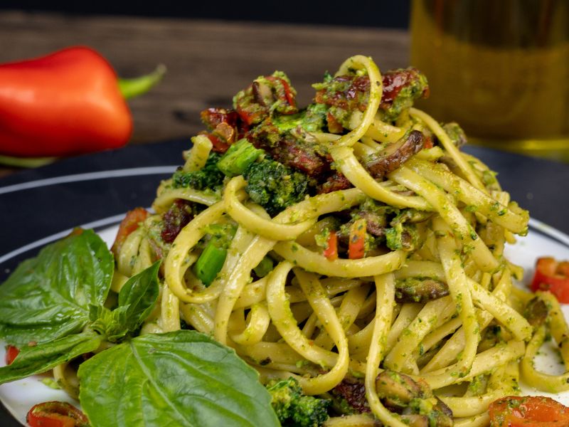 Pasta with Arugula Pesto, Stracciatella, and Sun-Dried Tomatoes